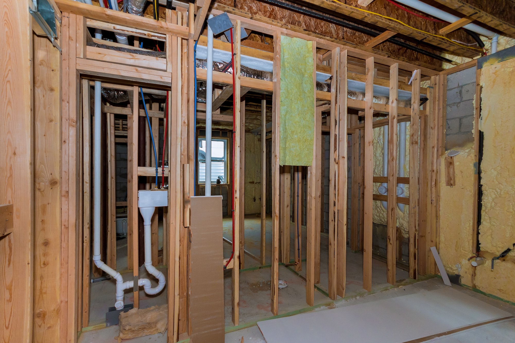 Under construction new home construction pipes and electrical unfinished basement