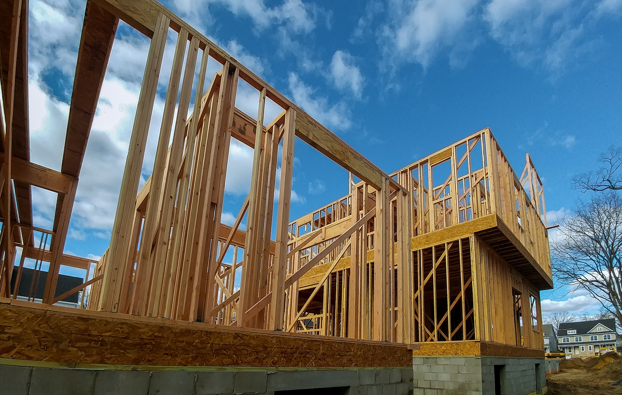 carpenter at work with wooden roof construction Wood Building frame